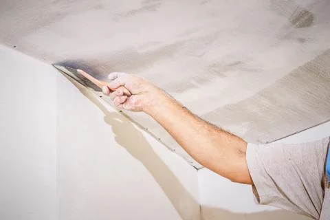 Manual worker with wall plastering tools Stock Photos