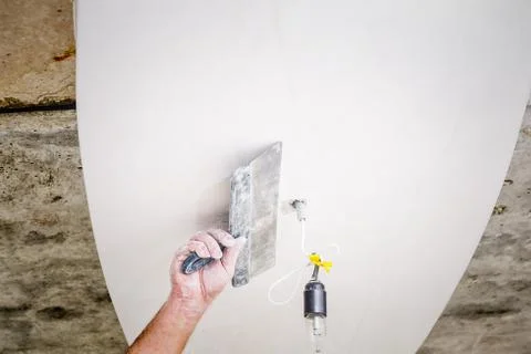 Manual worker with wall plastering tools Stock Photos