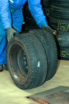 Manually changing tyres on a car Stock Photos