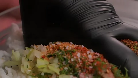 Manually mixing minced meat with onion and rice Stock-Footage 303424375
