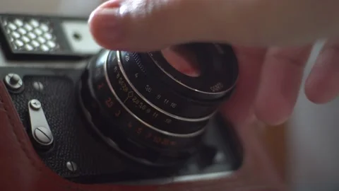 Manually remove the lens from the old camera Stock Footage 139688989