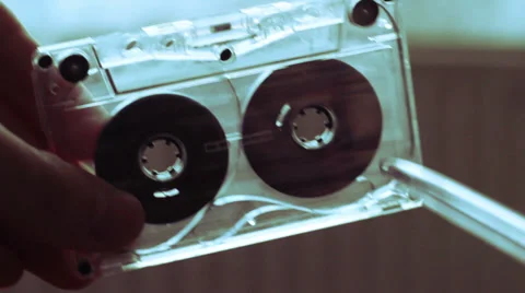 Manually Rewind a Cassette Tape Stock Footage 33073259