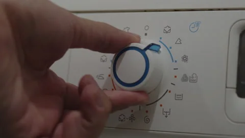 Manually setting washing machine programs 4K video Video stock 172039445