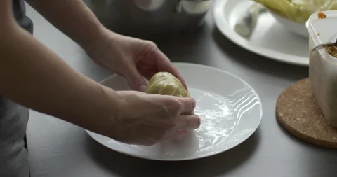 Manually shaping traditional dish sarma 5.7K video Stock Footage 302430161