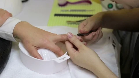 Manucirist cutting cuticle using cuticle scissors Video stock 81000214