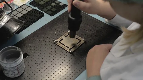 Manufacture of microchips. Step heating the solder paste with an industrial hair Stock Footage 85226289