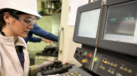 Manufacture workers working on electronic machine Stock Footage 59778932