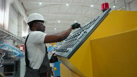 Manufacturing african worker programming industrial CNC machine tool at pvc 스톡 동영상 270104882