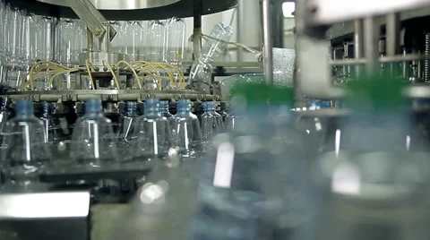 Manufacturing and filling plastic bottles with drinking water Stock Footage