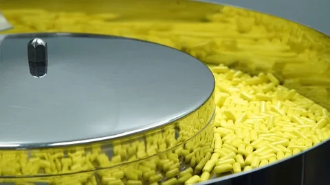 Manufacturing and packaging of tablets at a pharmaceutical plant Stock Footage 76099770