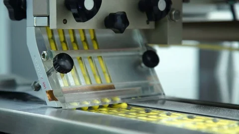 Manufacturing and packaging of tablets at a pharmaceutical plant Stock Footage 76100074