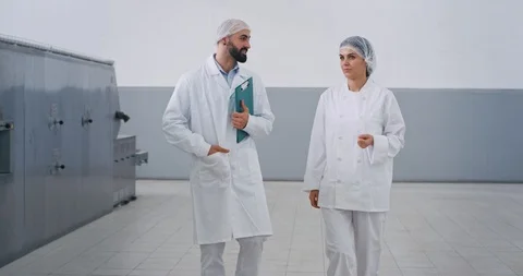 Manufacturing bakery industry baker and engineer walking through the factory Stock Footage 115636105