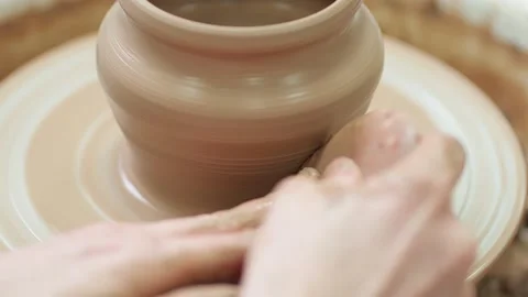 Manufacturing ceramics, handicrafts. making a clay pot in motion. Stock Footage