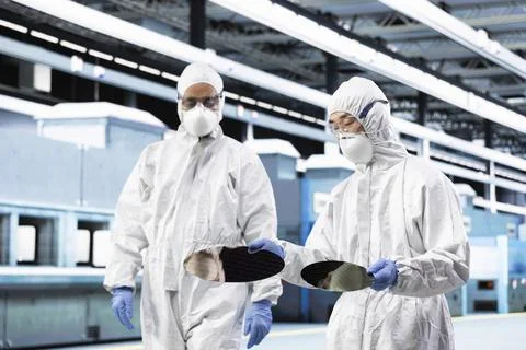 Manufacturing components, semiconductor substrate and team of experts Stock Photos