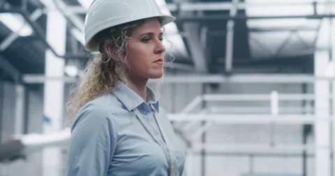 Manufacturing Engineer Walks Professionally Among Clean, Bright Structural Stock Footage 325734907