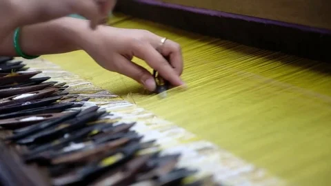 Manufacturing of fabrics for clothes on the loom Stock Footage 78885181