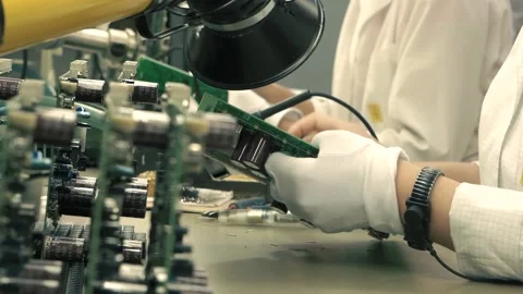 Manufacturing microcircuits using manual labor Stock Footage 144611760