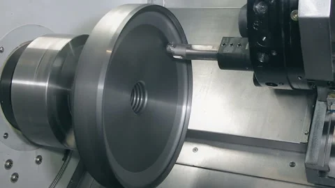 Manufacturing a part on a machine tool, side view Stock Footage 123003010