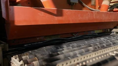 Manufacturing process of ceramic tiles. A production or conveyor line at a Video stock 332678590