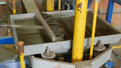 Manufacturing process of interlocking concrete tiles for road surface covering Stock Footage 95234023