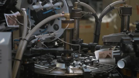 Manufacturing process of paper cup for coffee or tea. Rotating machine parts. Stock Footage 92674590