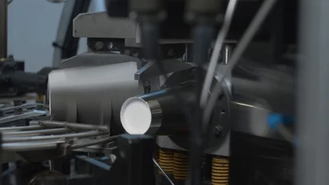 Manufacturing process of paper cup for coffee or tea. Rotating machine parts. Stock Footage 92676375