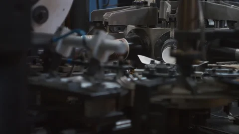 Manufacturing process of paper cup for coffee or tea. Rotating machine parts. Stock Footage 92677436