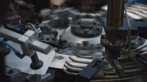 Manufacturing process of paper cup for coffee or tea. Rotating machine parts. Stock Footage 92680513
