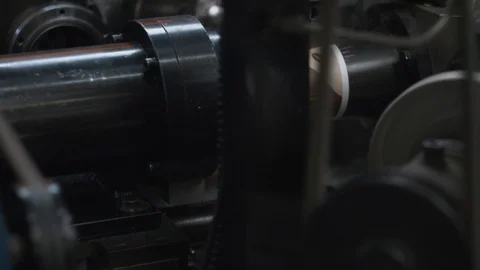 Manufacturing process of paper cup for coffee to go. Rotating machine parts. Stock Footage 92691771