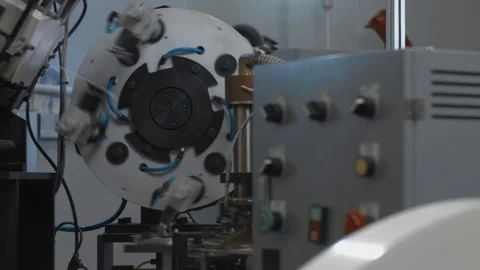 Manufacturing process of paper cup for coffee or tea. Rotating machine parts. Stock Footage 92724464