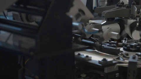 Manufacturing process of paper cup for coffee or tea. Rotating machine parts. Stock Footage 92727186