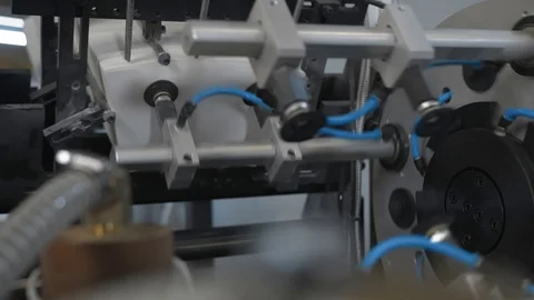 Manufacturing process of paper cup for coffee or tea. Rotating machine parts. Stock Footage 92798173