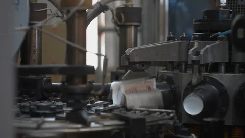 Manufacturing process of paper cups for hot drinks. Rotating machine parts. Stock Footage 92681788