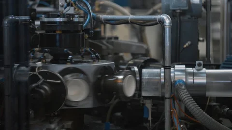 Manufacturing process of paper cups for hot drinks. Rotating machine parts. Stock Footage 92684483