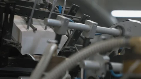Manufacturing process of paper cups for hot drinks. Rotating machine parts. Stock Footage 92688702