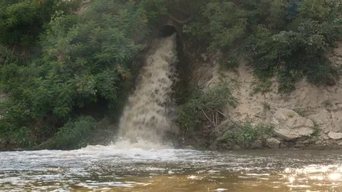 Manufacturing sewage flow in the river Stock Footage 78059912