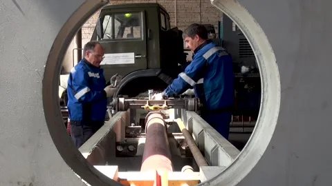 Manufacturing of URB 2A2 drilling rig.Installation of cart with rollers on mast Stock Footage 155726551