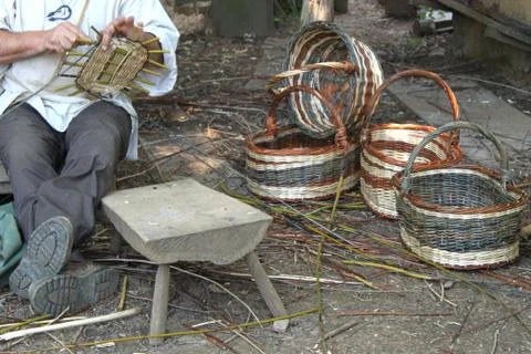 Manufacturing of wicker baskets Stock Photos