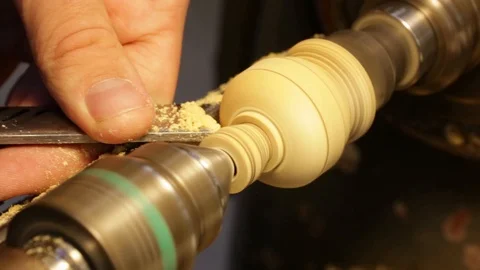 Manufacturing- wood turning with chisel in close up Stock Footage 97981992