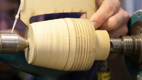 Manufacturing- wood turning: measuring using template Stock Footage 97982285