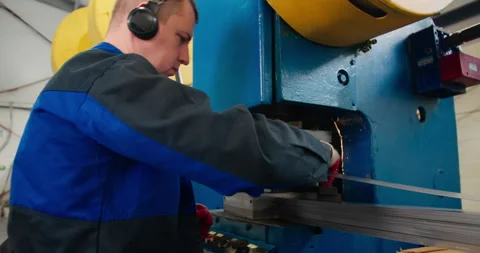 Manufacturing worker controlling press machine at production line Stock Footage 340066238