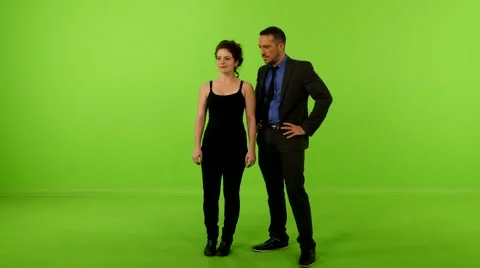 Man&amp;woman slide virtual screen greenscreen  4K Stockbeeldmateriaal 59778602