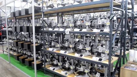 Many 3D printers printing an object. 3D printers simultaneously printing model Stock Footage 316513497