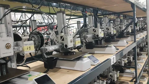 Many 3D printers printing an object. 3D printers simultaneously printing model Stock-Footage 316515177