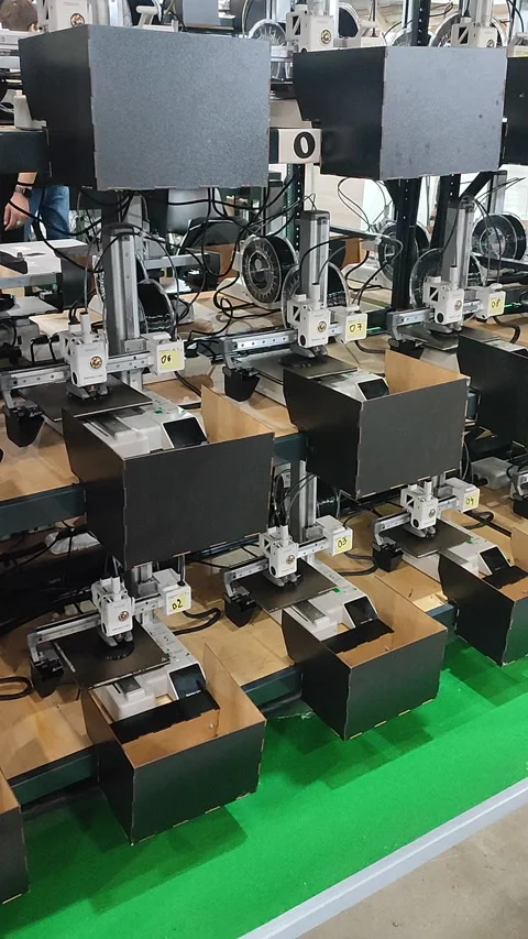 Many 3D printers printing object 3D printers simultaneously printing Vertical Stock Footage 319481388