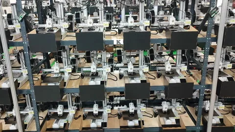 Many 3D printers printing an object. 3D printers simultaneously printing model Stock Footage 320827328