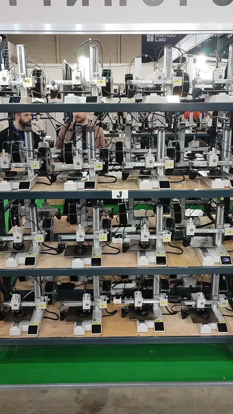 Many 3D printers printing object 3D printers simultaneously printing Vertical Stock Footage 320827535