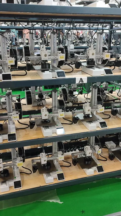 Many 3D printers printing object 3D printers simultaneously printing Vertical Stock Footage 320827594