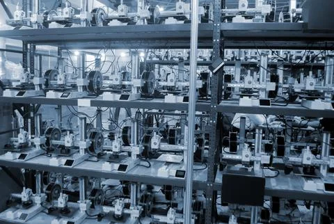 Many 3D printers printing an object. 3D printers simultaneously printing model Stock Photos