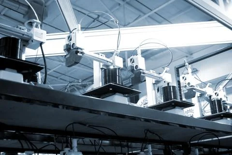 Many 3D printers printing object. 3D printers creating shape from molten plastic Stock Photos